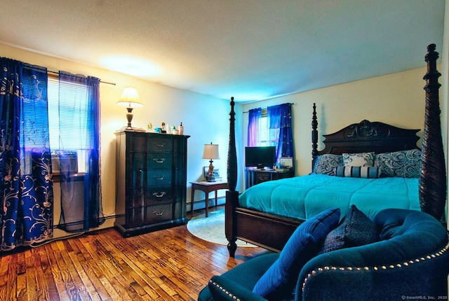 26 Lighthouse Hill Rd, Windsor, CT 06095 - bedroom with hardwood / wood-style floors and a baseboard heating unit