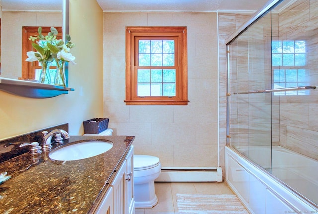 26 Lighthouse Hill Rd, Windsor, CT 06095 - bathroom with a baseboard heating unit, toilet, vanity, bath / shower combo with glass door, and tile patterned floors