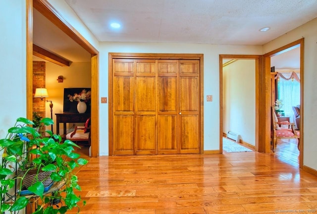 26 Lighthouse Hill Rd, Windsor, CT 06095 - foyer entrance with light wood finished floors, baseboard heating, recessed lighting, and baseboards