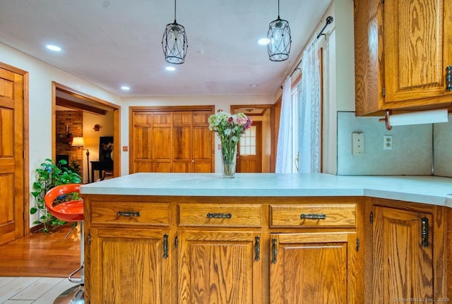 26 Lighthouse Hill Rd, Windsor, CT 06095 - kitchen with light countertops, brown cabinetry, a peninsula, light wood finished floors, and recessed lighting