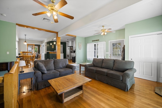 116 Grove St, Windsor Locks, CT 06096 - living area featuring a ceiling fan, wood finished floors, and beam ceiling