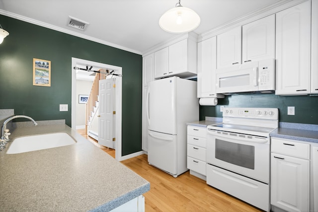 116 Grove St, Windsor Locks, CT 06096 - kitchen with white appliances, a sink, white cabinets, light wood-style flooring, and crown molding