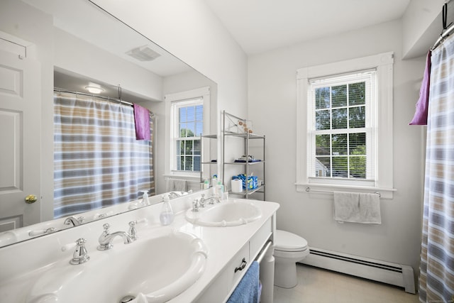 116 Grove St, Windsor Locks, CT 06096 - bathroom featuring a baseboard heating unit, toilet, and double vanity