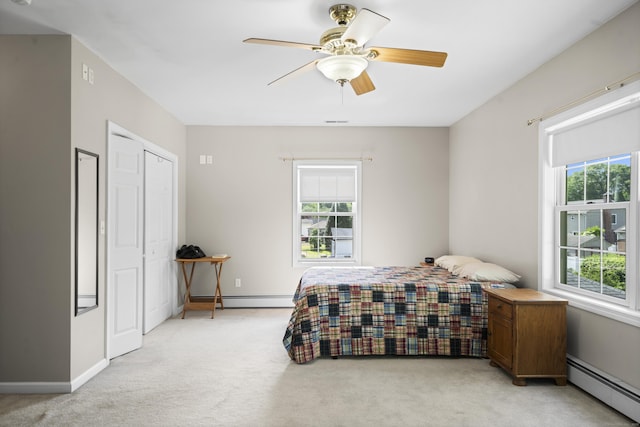116 Grove St, Windsor Locks, CT 06096 - bedroom with a baseboard radiator, light carpet, a ceiling fan, and a closet