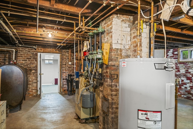 116 Grove St, Windsor Locks, CT 06096 - basement featuring water heater, oil tank, and brick wall