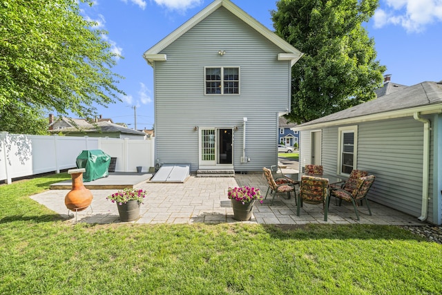 116 Grove St, Windsor Locks, CT 06096 - rear view of house with a patio