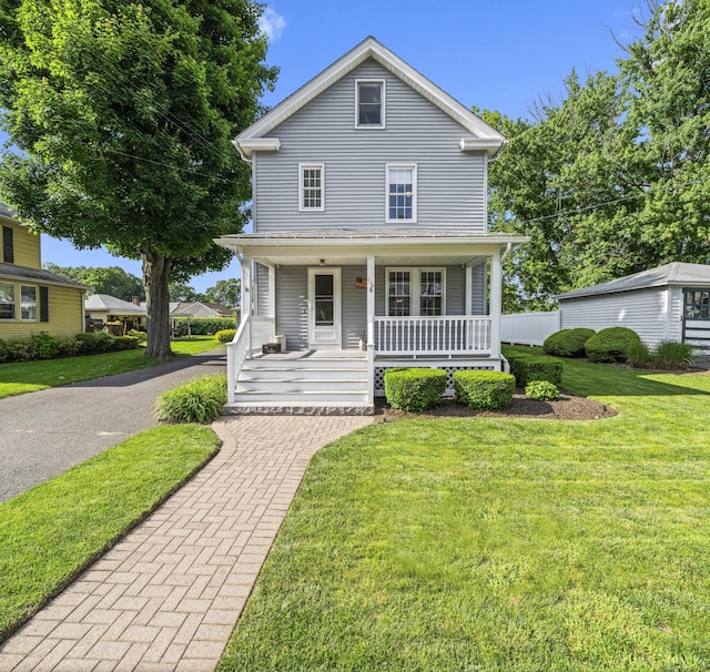 116 Grove St, Windsor Locks, CT 06096 - american foursquare style home with a front lawn and covered porch