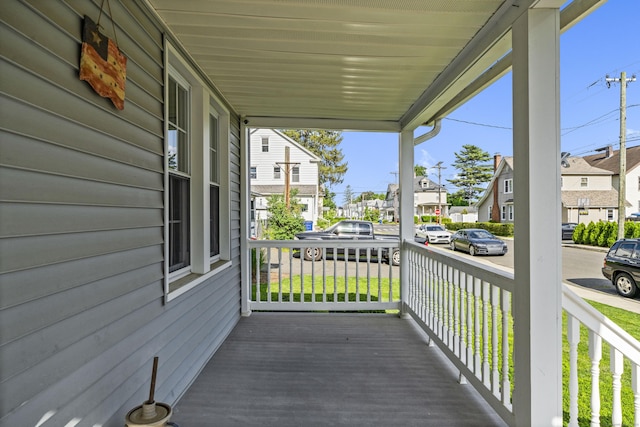 116 Grove St, Windsor Locks, CT 06096 - wooden porch featuring a residential view