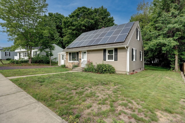 379 Belden Rd, Hamden, CT 06514 - view of front facade featuring roof mounted solar panels and a front yard