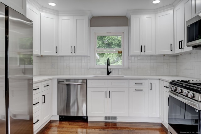 379 Belden Rd, Hamden, CT 06514 - kitchen featuring appliances with stainless steel finishes, a sink, recessed lighting, white cabinetry, and dark wood-style floors