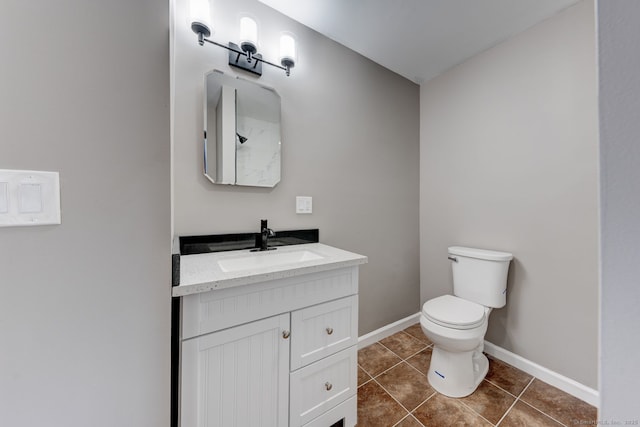 379 Belden Rd, Hamden, CT 06514 - bathroom featuring vanity, toilet, tile patterned flooring, and baseboards