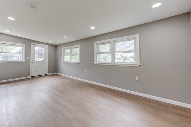 379 Belden Rd, Hamden, CT 06514 - empty room with baseboards, light wood-style floors, recessed lighting, a smoke detector, and lofted ceiling