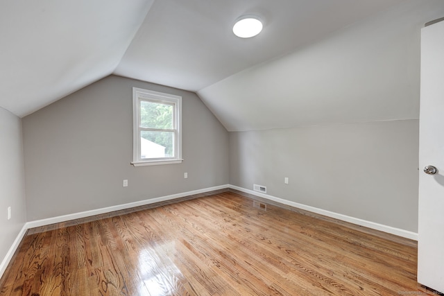 379 Belden Rd, Hamden, CT 06514 - bonus room featuring light wood-type flooring, vaulted ceiling, and baseboards
