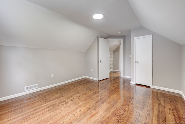 379 Belden Rd, Hamden, CT 06514 - additional living space featuring lofted ceiling, wood finished floors, and baseboards
