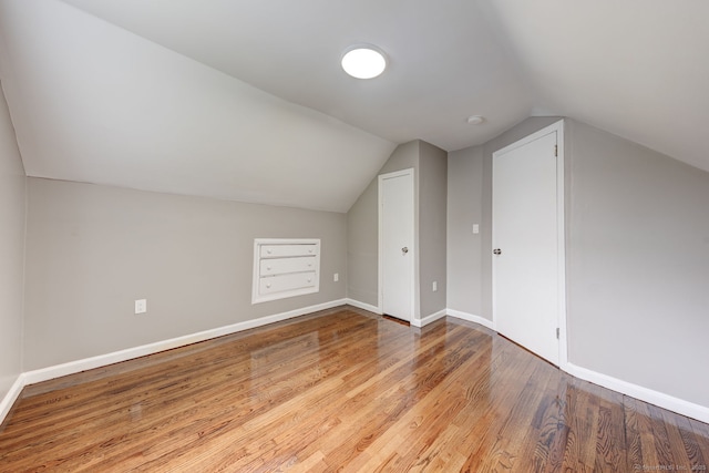 379 Belden Rd, Hamden, CT 06514 - bonus room featuring vaulted ceiling, wood finished floors, and baseboards