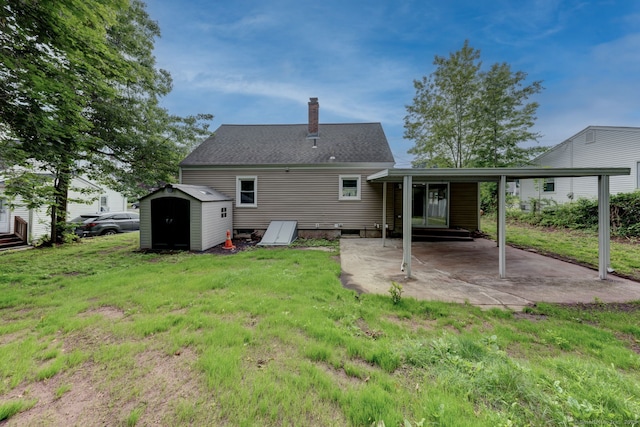 379 Belden Rd, Hamden, CT 06514 - back of house with a chimney, a yard, and a patio