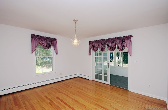 467 Weekeepeemee Rd, Woodbury, CT 06798 - spare room with a chandelier, light wood-style flooring, and healthy amount of natural light