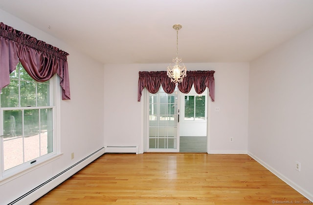 467 Weekeepeemee Rd, Woodbury, CT 06798 - empty room featuring a chandelier, plenty of natural light, light wood-style floors, and baseboard heating