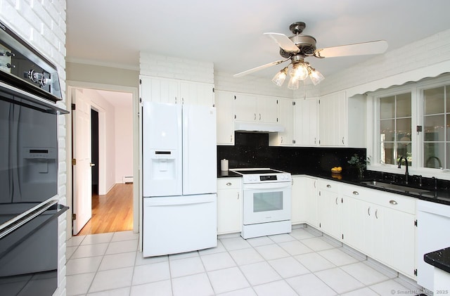467 Weekeepeemee Rd, Woodbury, CT 06798 - kitchen with white appliances, a sink, under cabinet range hood, dark countertops, and crown molding