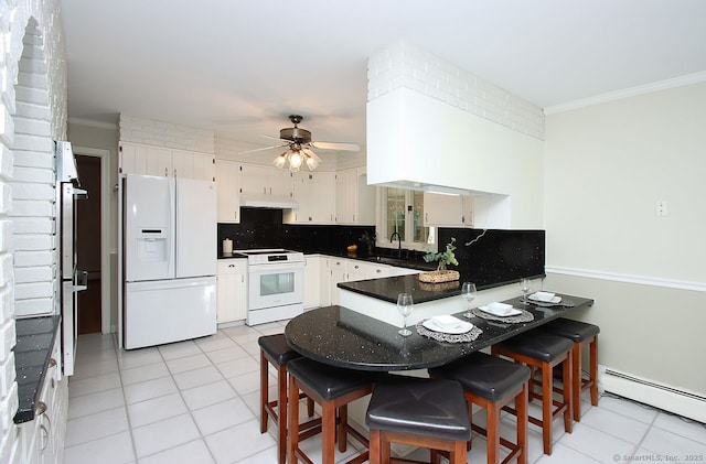 467 Weekeepeemee Rd, Woodbury, CT 06798 - kitchen featuring white appliances, a peninsula, under cabinet range hood, a baseboard radiator, and light tile patterned floors
