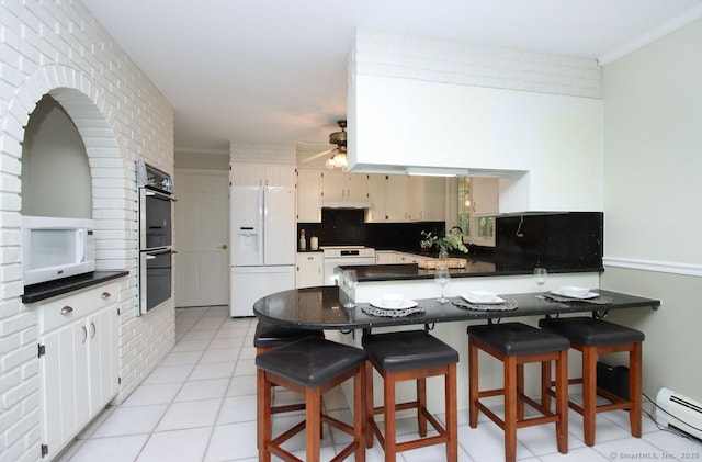467 Weekeepeemee Rd, Woodbury, CT 06798 - kitchen featuring white appliances, baseboard heating, a peninsula, backsplash, and a ceiling fan