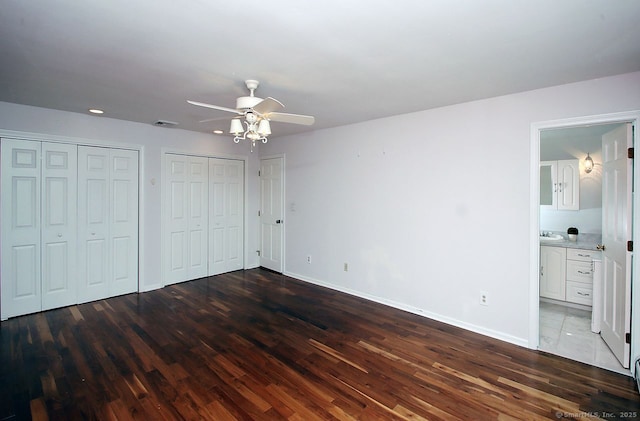 467 Weekeepeemee Rd, Woodbury, CT 06798 - unfurnished bedroom with wood finished floors, multiple closets, baseboards, and connected bathroom