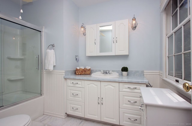 467 Weekeepeemee Rd, Woodbury, CT 06798 - bathroom with a wainscoted wall, vanity, toilet, enclosed tub / shower combo, and marble look tiles