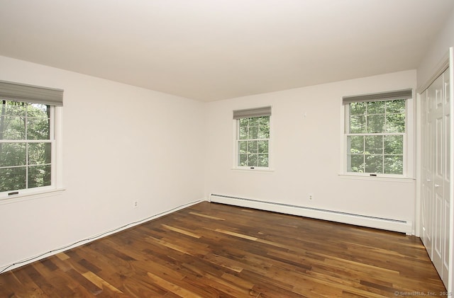 467 Weekeepeemee Rd, Woodbury, CT 06798 - unfurnished room with a baseboard heating unit, dark wood finished floors, and healthy amount of natural light