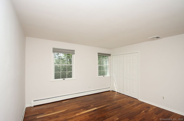 467 Weekeepeemee Rd, Woodbury, CT 06798 - unfurnished bedroom featuring a baseboard radiator, wood finished floors, a closet, and baseboards