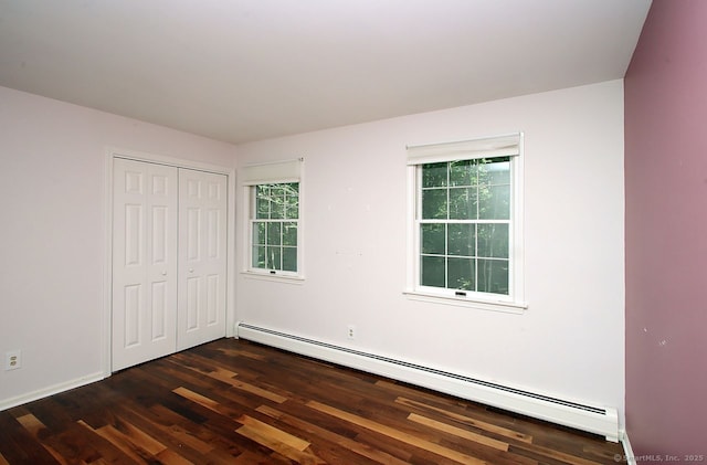 467 Weekeepeemee Rd, Woodbury, CT 06798 - unfurnished bedroom with a baseboard radiator, dark wood-type flooring, a closet, and baseboards