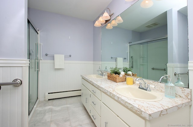 467 Weekeepeemee Rd, Woodbury, CT 06798 - bathroom with a baseboard heating unit, wainscoting, a shower stall, and double vanity