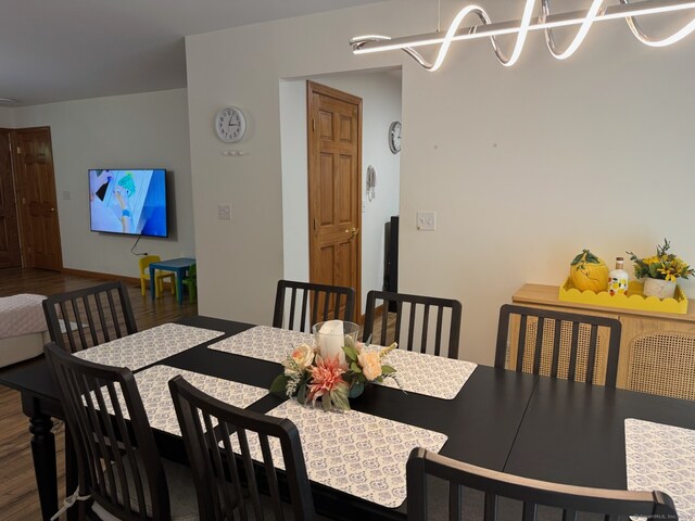 218 Fish Rock Rd, Southbury, CT 06488 - dining area featuring wood finished floors and a chandelier