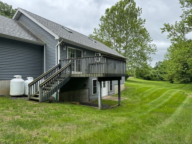 218 Fish Rock Rd, Southbury, CT 06488 - back of property featuring a shingled roof, a deck, a yard, and stairway