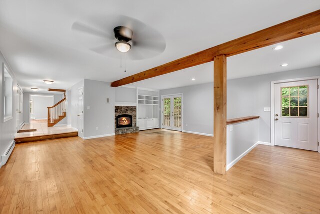 15 Indian Hill Rd, Canton, CT 06019 - unfurnished living room featuring light wood finished floors, beam ceiling, ceiling fan, stairs, and a fireplace