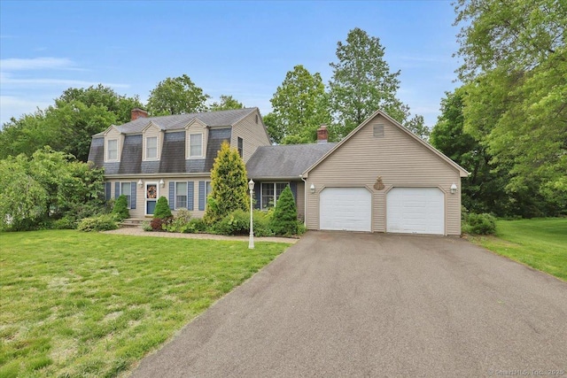 79 Carriage Dr E, Meriden, CT 06450 - dutch colonial with a chimney, a garage, a gambrel roof, asphalt driveway, and a front lawn