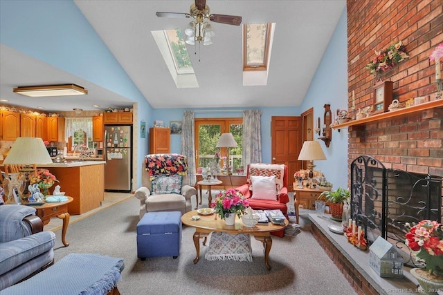79 Carriage Dr E, Meriden, CT 06450 - living room featuring ceiling fan, high vaulted ceiling, a skylight, a brick fireplace, and light carpet