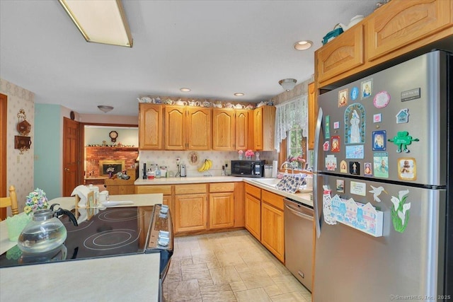 79 Carriage Dr E, Meriden, CT 06450 - kitchen with appliances with stainless steel finishes, light countertops, light stone finish flooring, recessed lighting, and backsplash