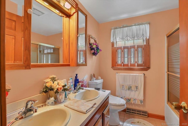 79 Carriage Dr E, Meriden, CT 06450 - full bathroom with toilet, double vanity, and tile patterned flooring
