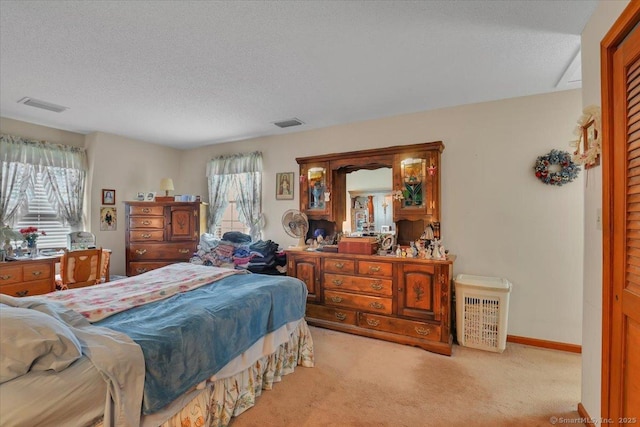 79 Carriage Dr E, Meriden, CT 06450 - bedroom featuring multiple windows, light colored carpet, and a textured ceiling