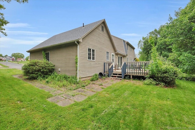79 Carriage Dr E, Meriden, CT 06450 - back of property with a wooden deck and a yard