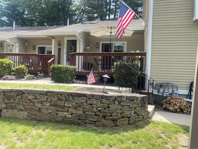 477 Carriage Dr Unit 477, Southington, CT 06489 - rear view of property featuring a wooden deck and roof with shingles