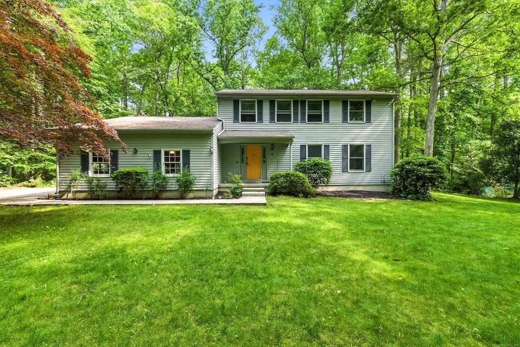 8 Whippoorwill Dr, Ledyard, CT 06335 - colonial-style house with a front lawn