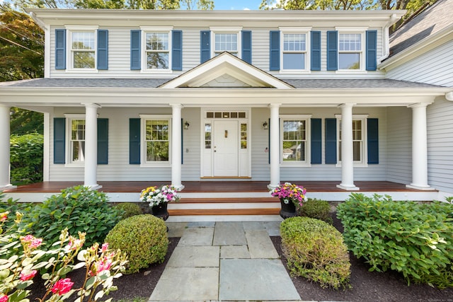 31 Pleasant St, Darien, CT 06820 - doorway to property featuring covered porch and a shingled roof