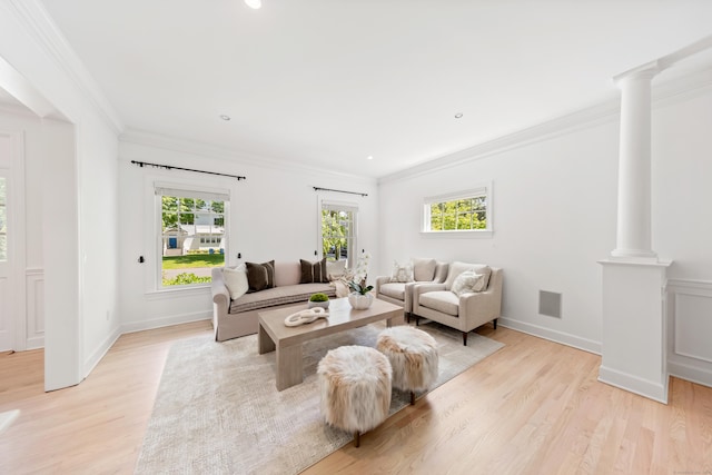 31 Pleasant St, Darien, CT 06820 - living area featuring decorative columns, light wood finished floors, ornamental molding, baseboards, and recessed lighting