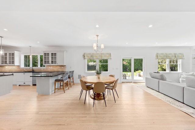 31 Pleasant St, Darien, CT 06820 - dining area featuring healthy amount of natural light, light wood-style flooring, a chandelier, and recessed lighting
