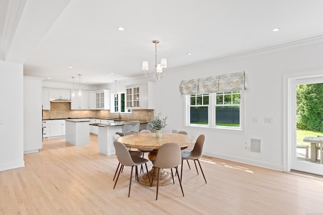 31 Pleasant St, Darien, CT 06820 - dining room featuring light wood finished floors, crown molding, recessed lighting, a chandelier, and baseboards
