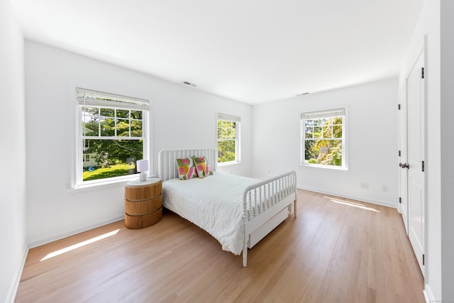 31 Pleasant St, Darien, CT 06820 - bedroom featuring light wood finished floors and baseboards