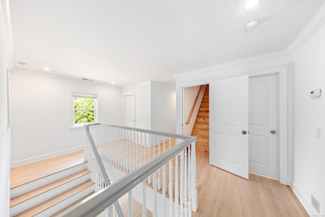 31 Pleasant St, Darien, CT 06820 - hall featuring light wood finished floors, an upstairs landing, crown molding, baseboards, and recessed lighting