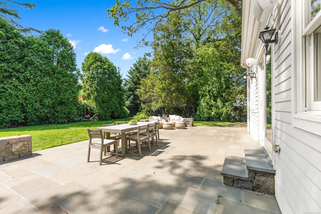 31 Pleasant St, Darien, CT 06820 - view of patio / terrace featuring outdoor dining area and view of wooded area