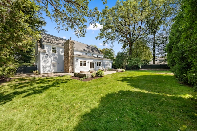 31 Pleasant St, Darien, CT 06820 - back of property featuring a patio and a chimney
